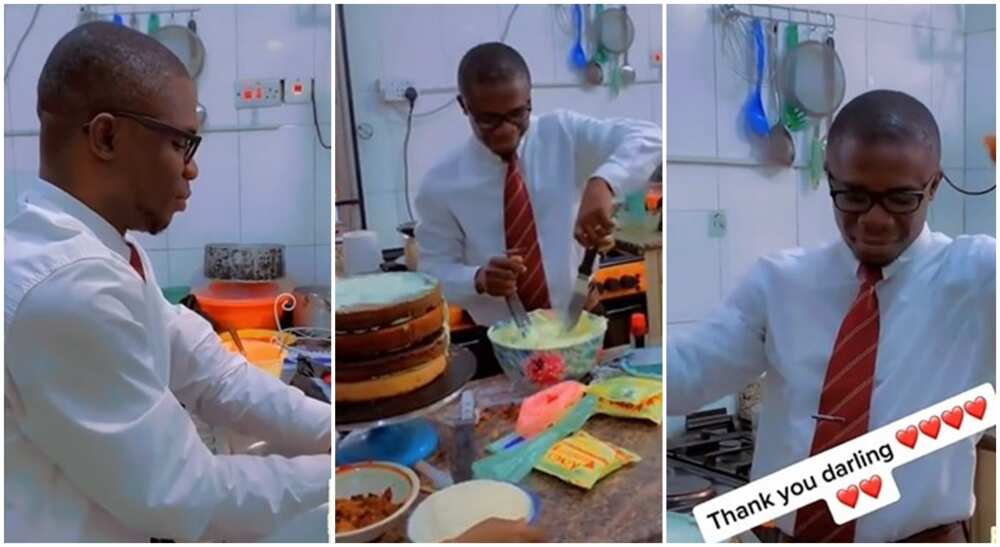 Photo of black man helping his wife out in kitchen.