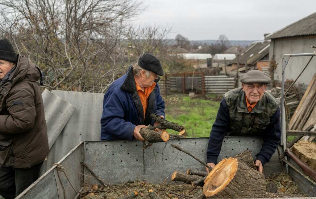 War-weary Ukraine residents chop wood to 'survive' winter