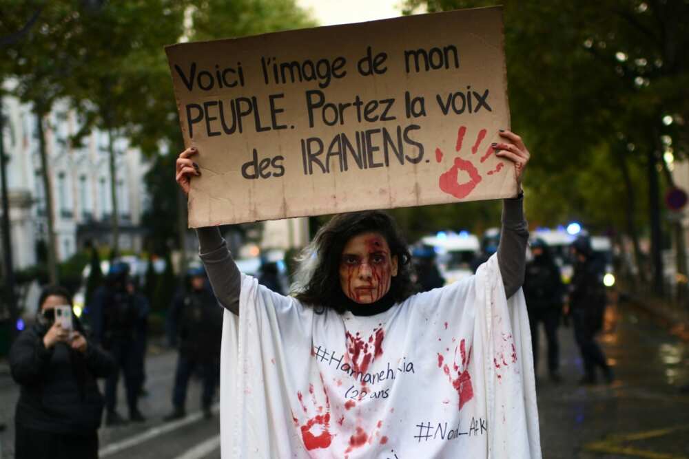 'This is the image of my people,' said a Paris protester's sign