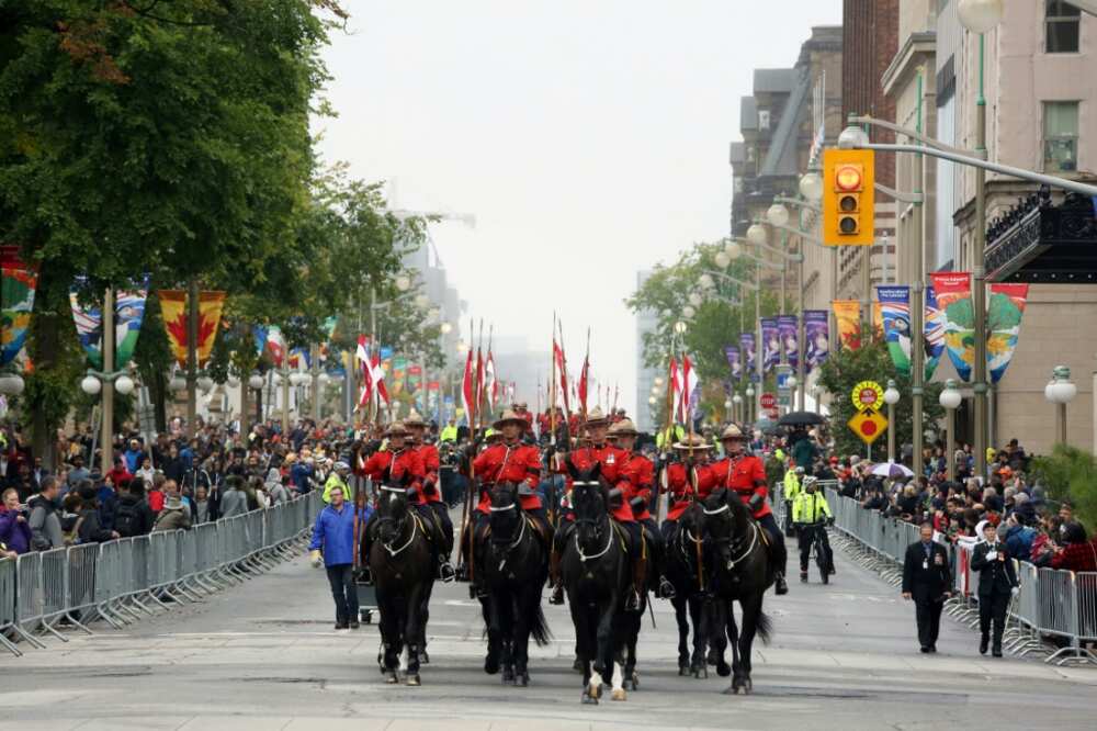 Royal Canadian Mounted Police Musical Ride leads a military parade in downtown Ottawa, Canada for a memorial service for Queen Elizabeth II
