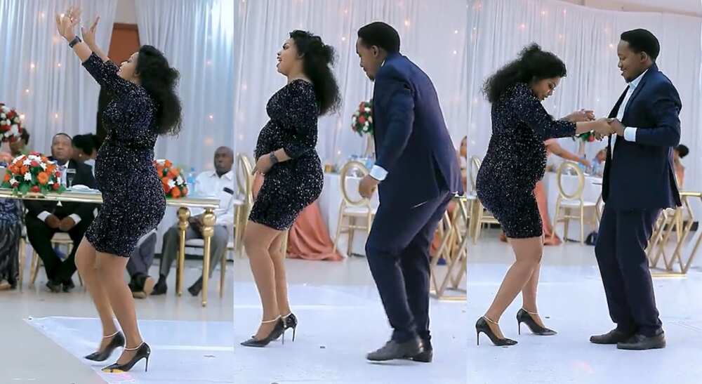 Photos of a pregnant woman dancing with man.