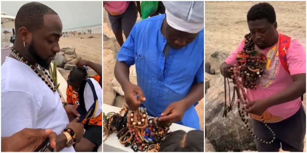 Davido buys bracelets from hawkers by the beachside in Ghana