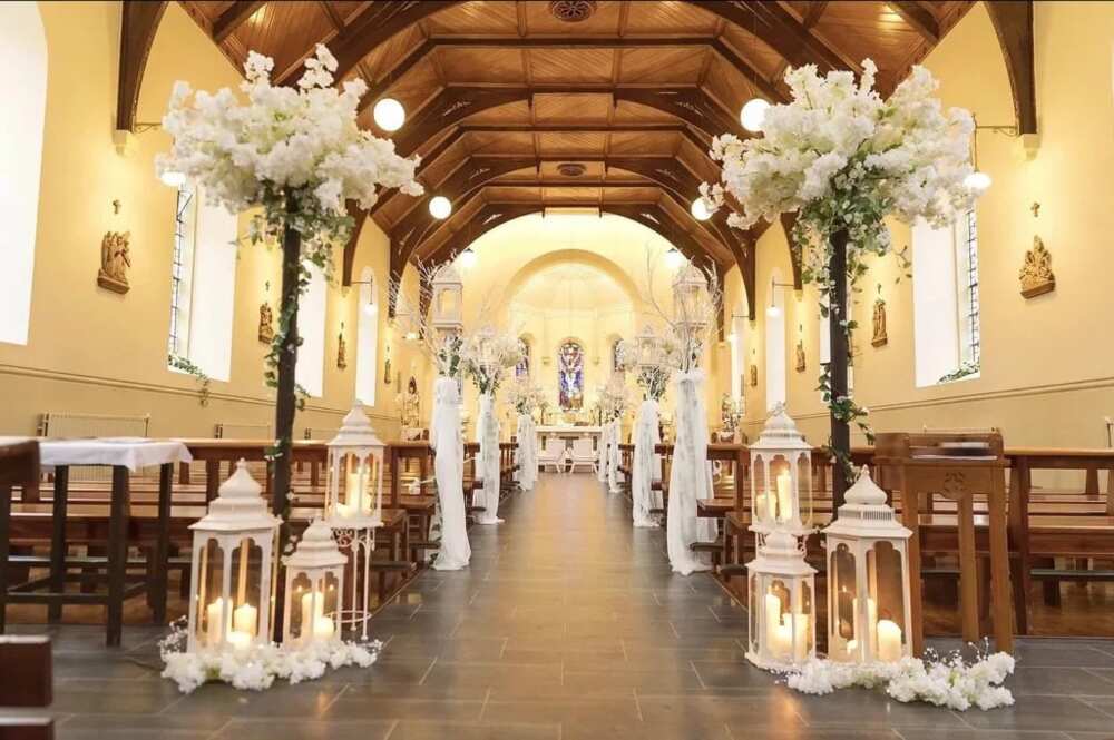 Candles and flowers for pews decoration