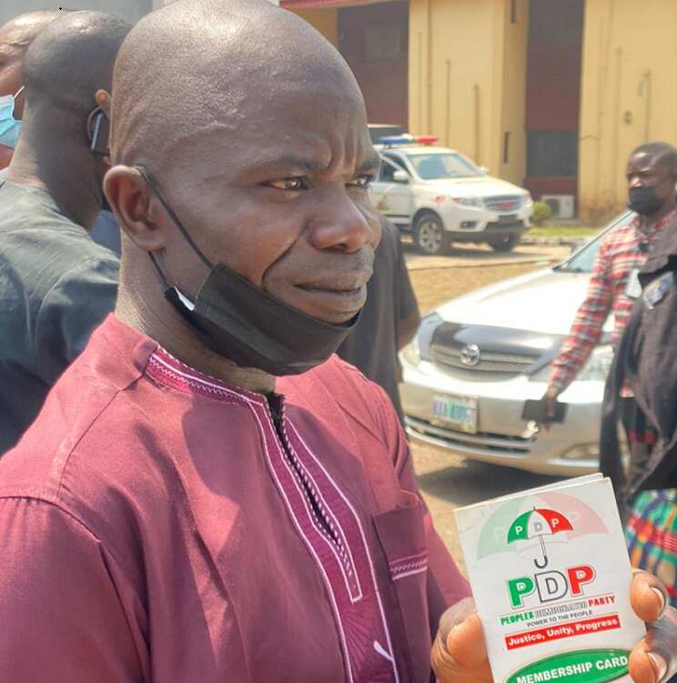 Delegate from Moba LGA proudly shows off his membership card.