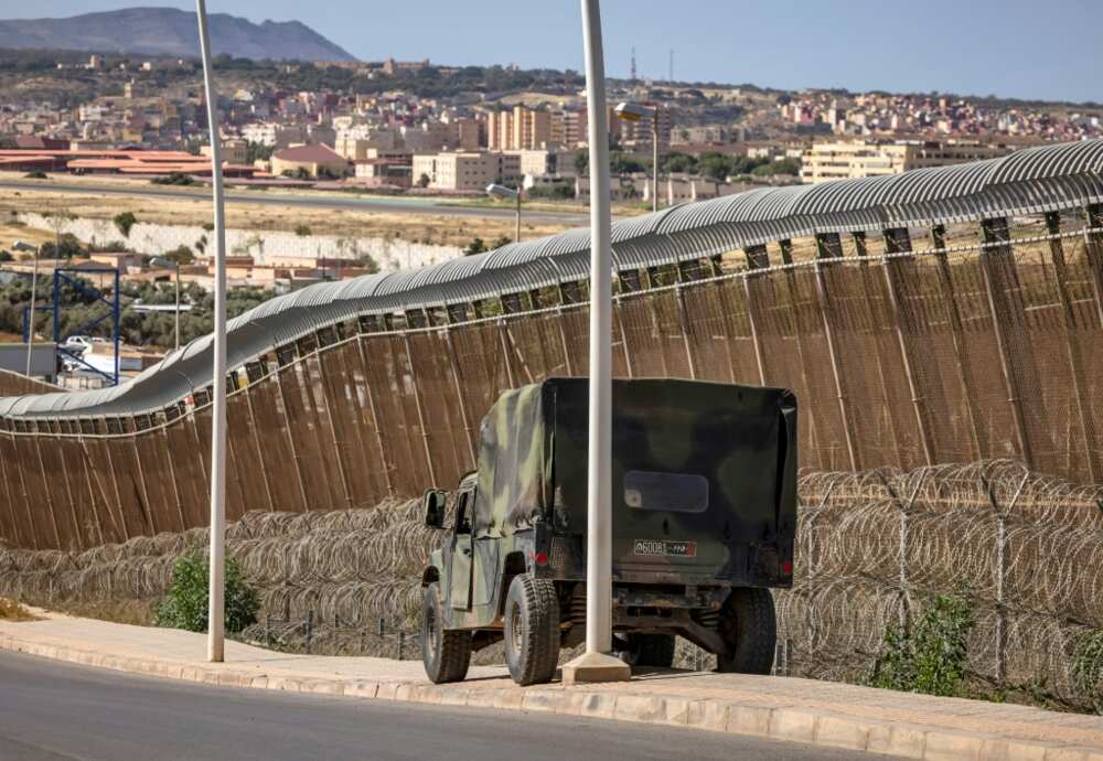 A Moroccan security forces vehicle posted at the border fence separating Morocco from Spain's Melilla enclave