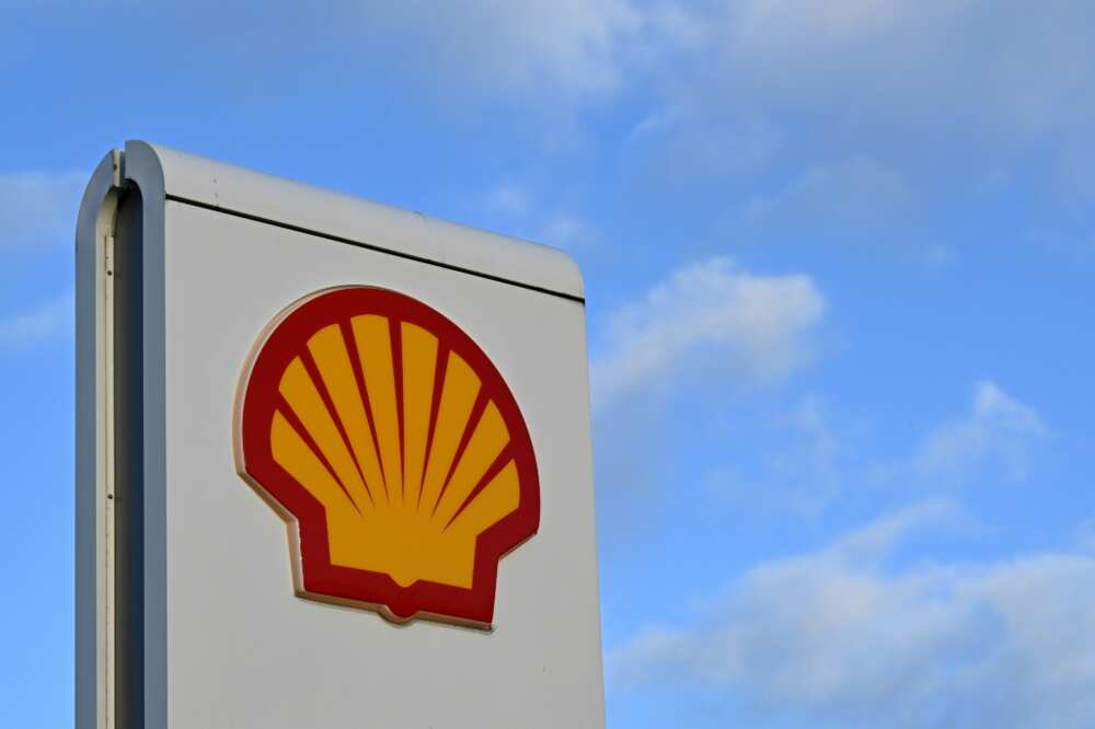 Shell's net  fell arsenic  state  prices dropped