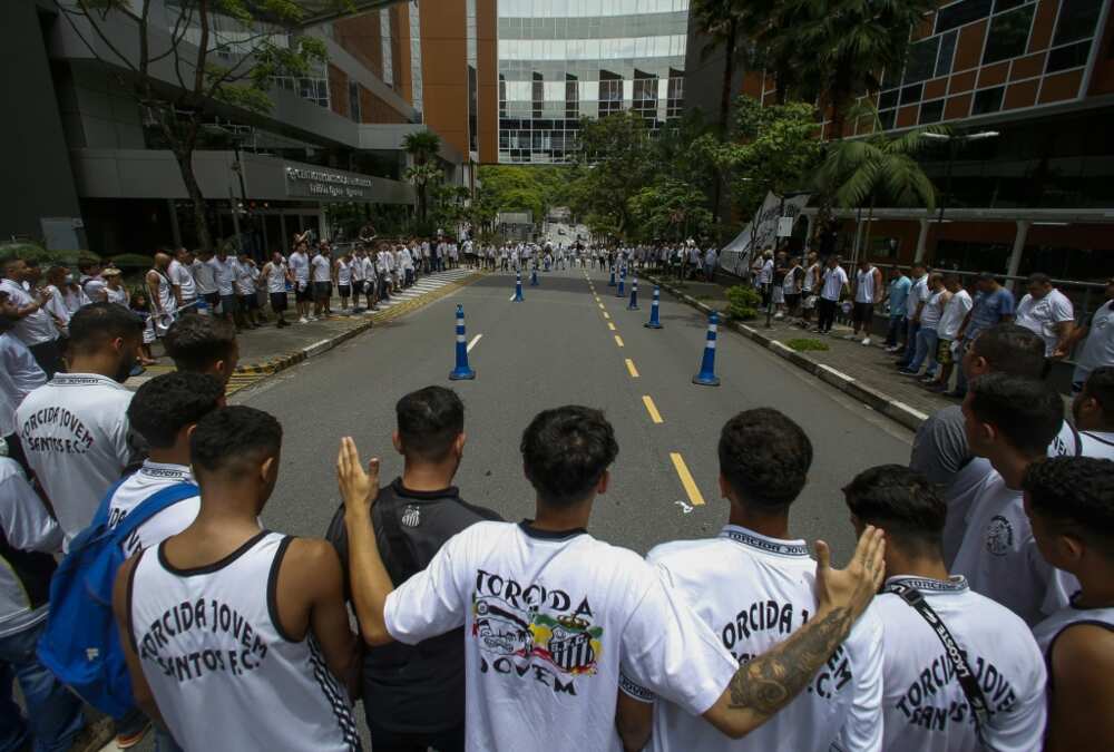 Hundreds of football fans took part in a vigil on December 4, 2022 outside the Sao Paulo clinic where Brazilian superstar Pele is battling a respiratory infection