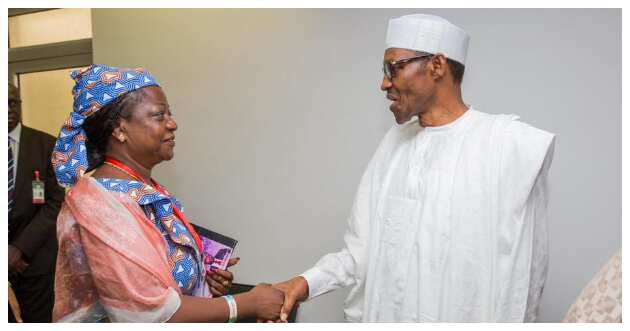 Onochie having a handshake from Buhari