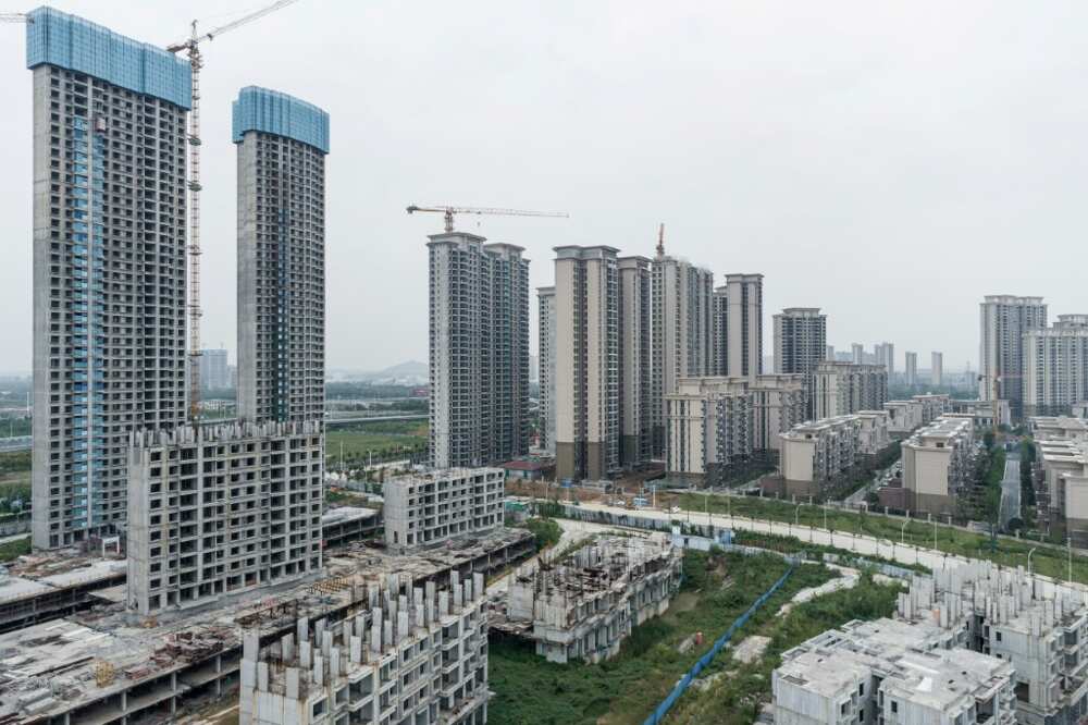 China's economy is forecast to grow less quickly than anticipated due to troubles in the real estate sector
