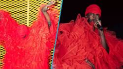 Black Sherif causes stir as he slays in red tulle top and trousers, many call him a flower boy