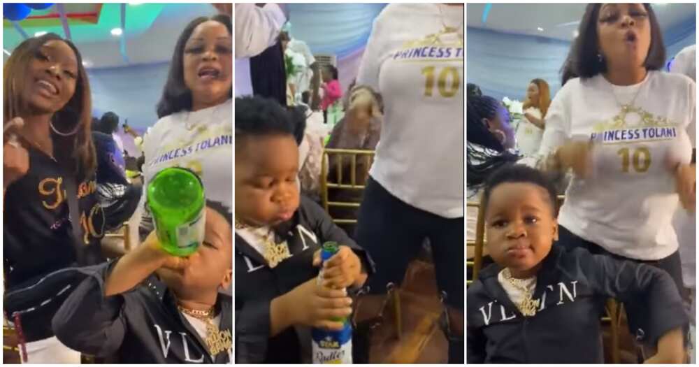 Nigerians react to video of little boy drinking beer at event and dancing with women