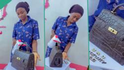 "You are good": Nigerian baker makes beautiful handbag cake, displays it in viral TikTok video
