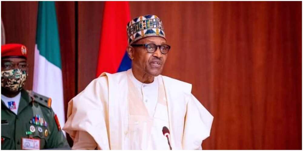 Nigeria's President, Muhammadu Buhari, standing in front of his guard.