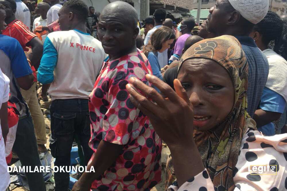 Breaking: Locals pelt Ambode as governor visits scene of building collapse