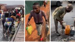 "This is dangerous": Tanker falls and spills petroleum product, many Nigerians gather to scoop fuel