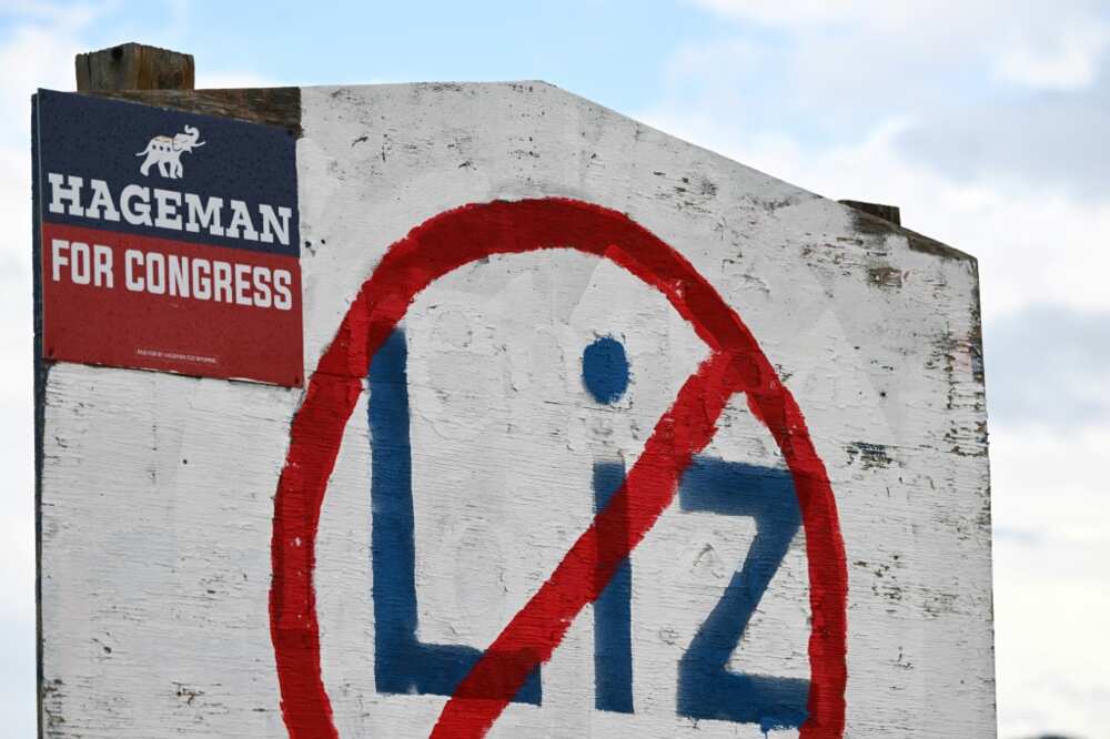 A hand painted sign stands in opposition to US Representative Liz Cheney (R-WY) displayed on the side of a road along with support of her Republican primary opponent Harriet Hageman in Casper, Wyoming A hand painted sign stands in opposition to US Representative Liz Cheney (R-WY) displayed on the side of a road along with support of her Republican primary opponent Harriet Hageman in Casper, Wyoming