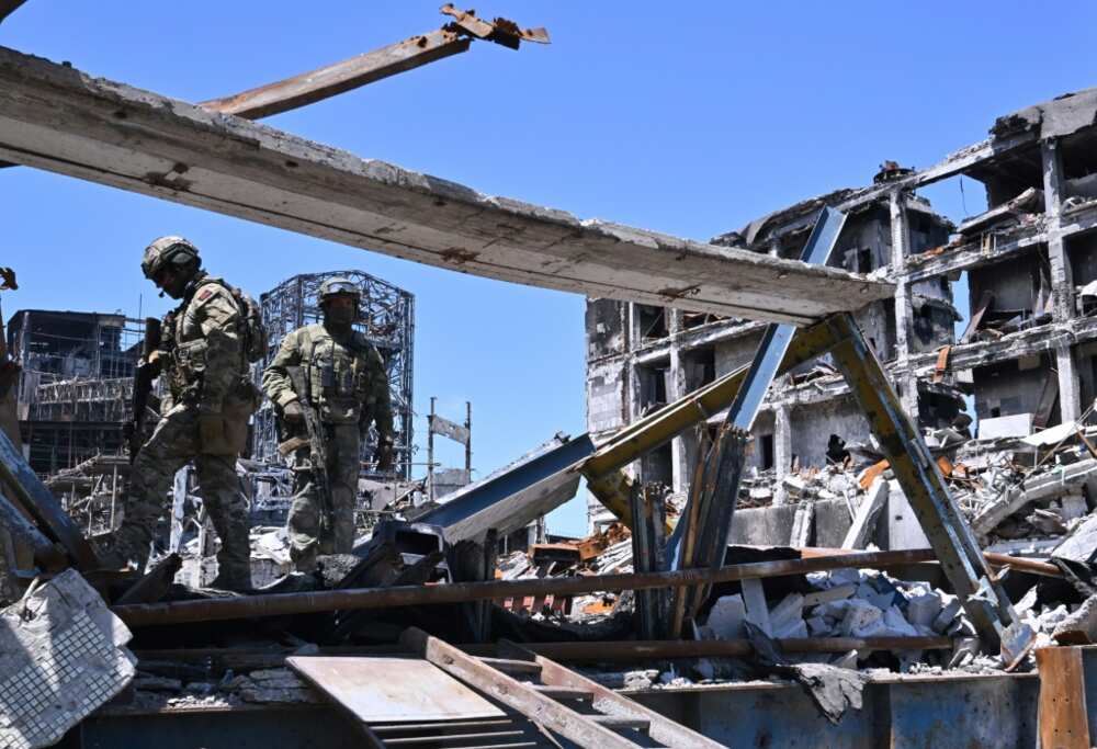 Russian servicemen in the ruins of the Azovstal steel plant in Mariupol. But weeks of Ukraine resistance prevented Russian forces from redeploying to the Donbas region