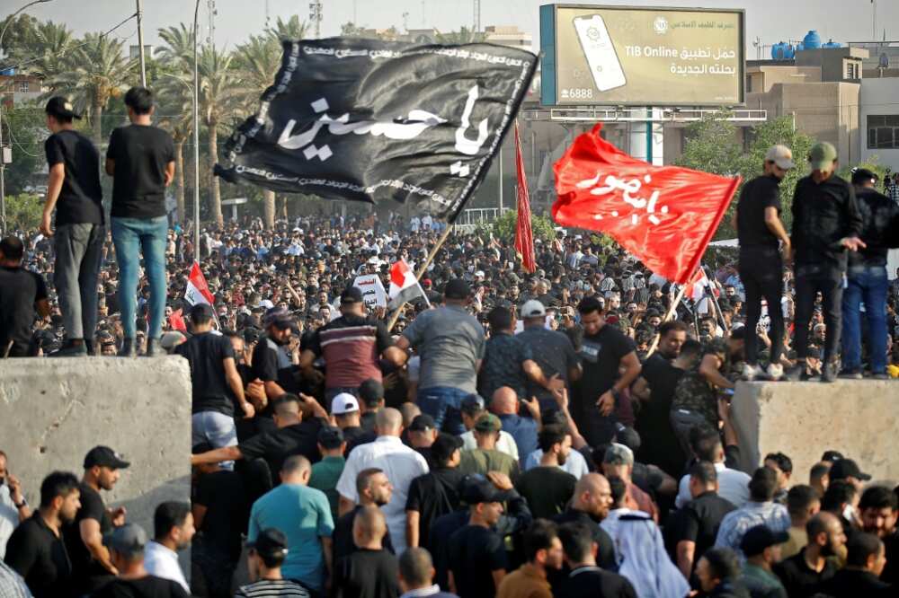Supporters of Iraq's Coordination Framework take part in a counter-protest outside Baghdad's Green Zone on Monday Supporters of Iraq's Coordination Framework take part in a counter-protest outside Baghdad's Green Zone on Monday