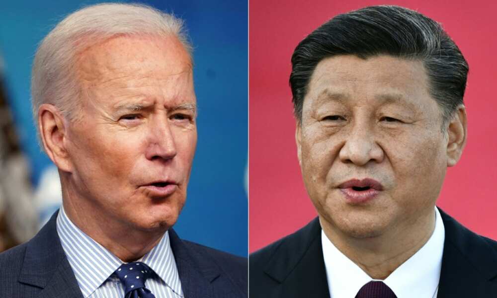Chinese President Xi Jinping (R) warned American counterpart Joe Biden in a late July phone call that the United States shouldn't 'play with fire' over Taiwan