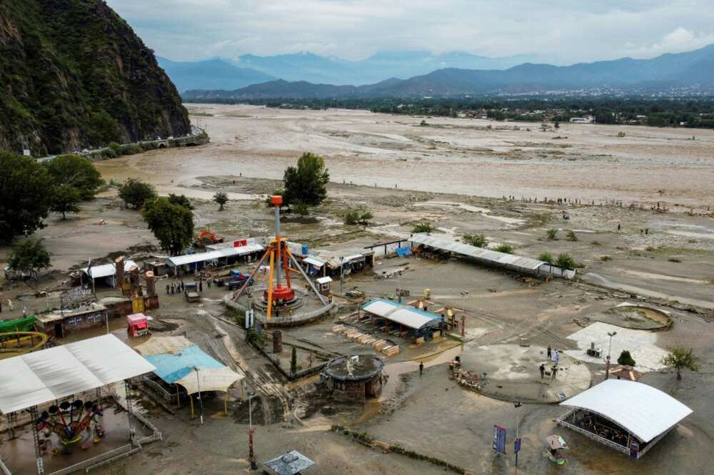 The river through Mingora had risen more than three metres and burst it banks, flooding an amusement park