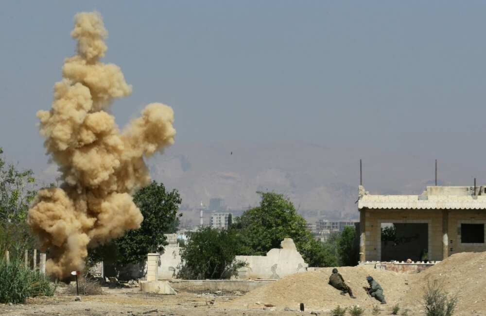 Ordnance is blown up during a training session to clear munitions in the countryside near the Syrian capital Damascus