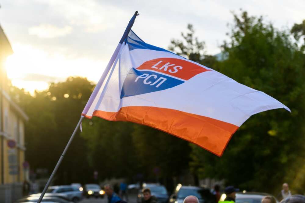 The Latvian-Russian Union flag is waved at a protest against a refoirm making Latvian the only language of instruction