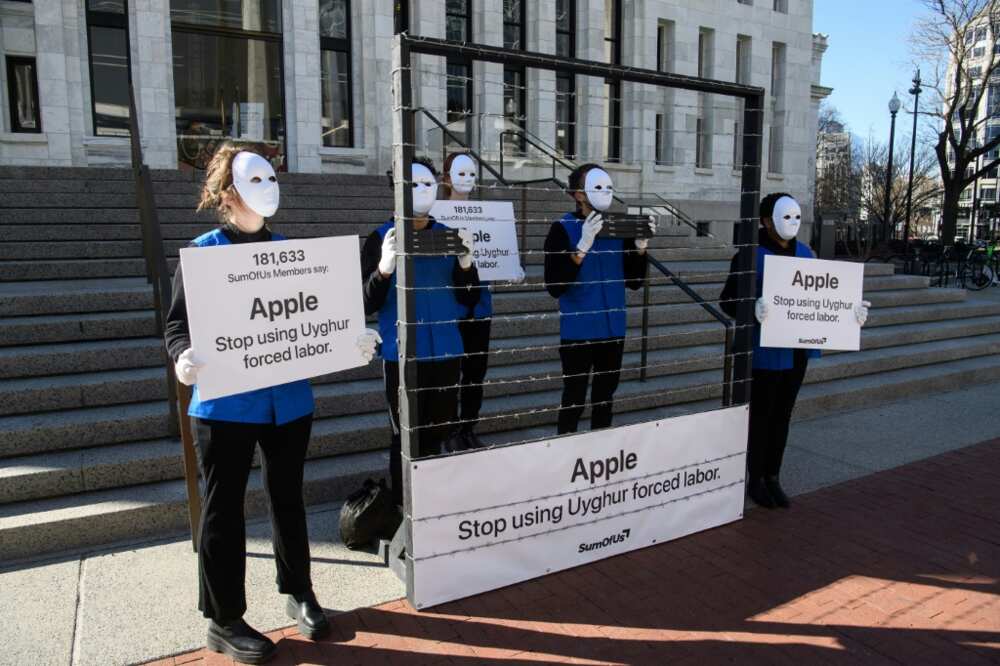 Demonstrators set up a mock Uyghur forced labor camp outside the Apple flagship store in Washington DC in March 2022, to call for the company not to use Uyghur forced labor
