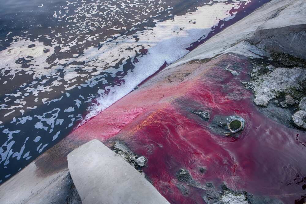 Waste from textile factories is released in a river in India Waste from textile factories is released in a river in India