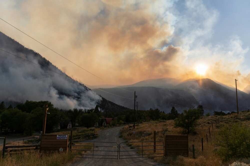 Smoke pours from the Crater Creek Fire, one of hundreds of active wildfires in westernmost British Columbia province