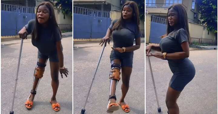 Lady dances with crutches, middle of the road, omentee