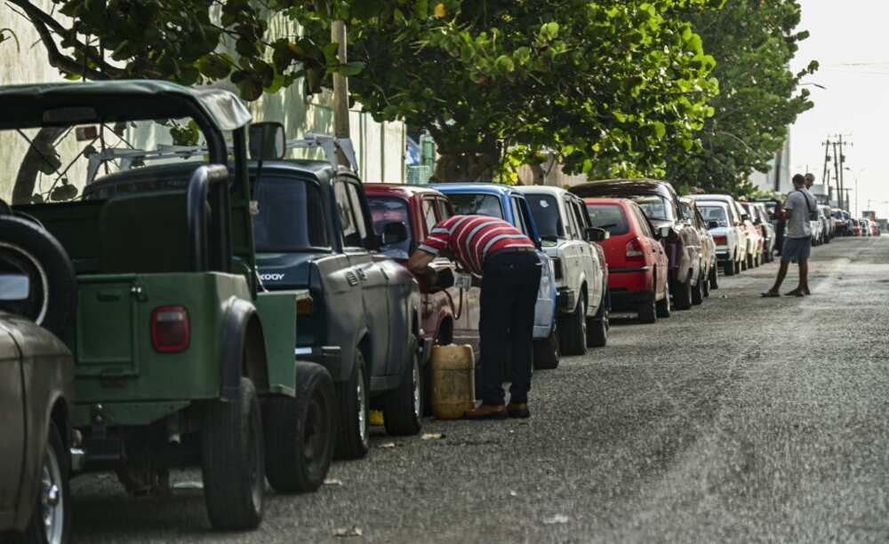 Cuban service stations have created WhatsApp groups to organize customers, who often have to queue down the block for a chance to get gasoline