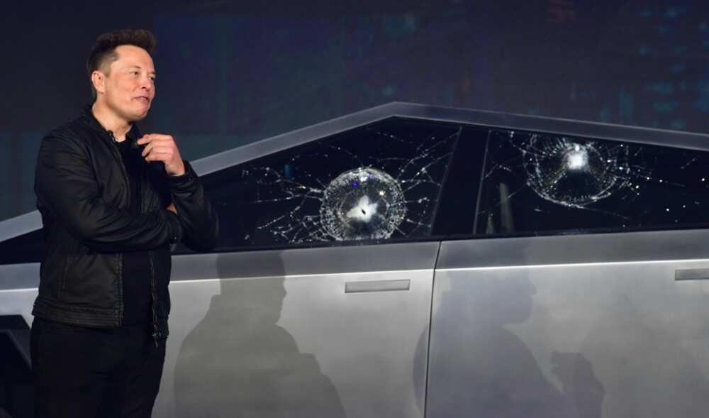 Tesla co-founder and CEO Elon Musk verbally reacts in front of the newly unveiled all-electric battery-powered Tesla Cybertruck with broken glass on windows following a demonstation that did not go as planned on November 21, 2019 at Tesla Design Center in Hawthorne, California