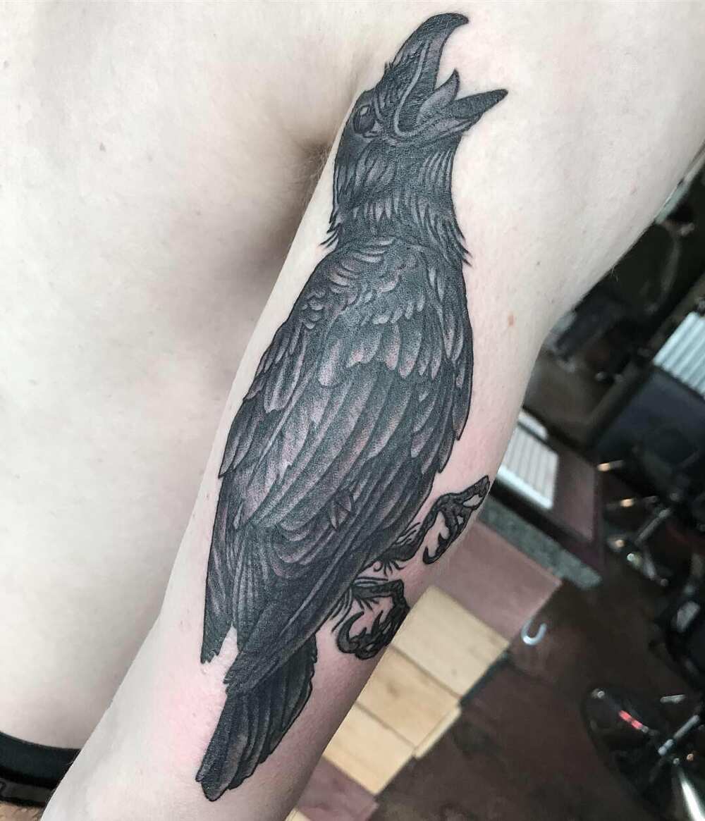 Raven Flying Silhouette Tattoo