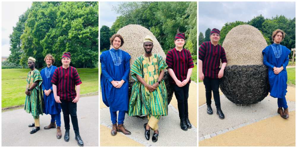 Man gush as young Nigerian man rocks cultural attire with his UK colleagues in fine photos