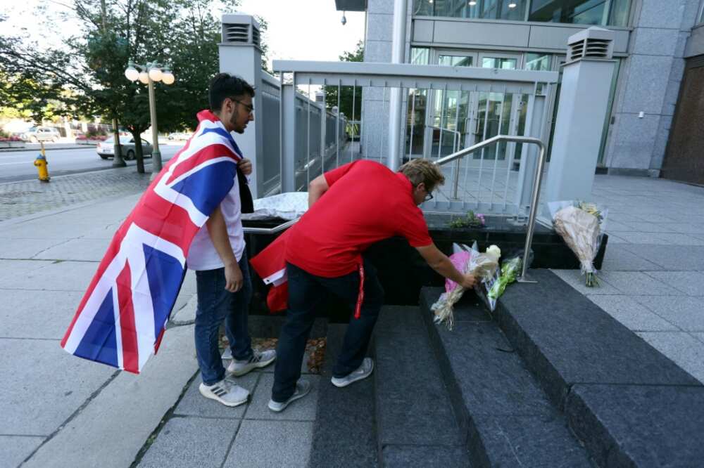 Mourners in Ottawa, Canada place flowers on the front steps of the British High Commission after the death of Queen Elizabeth II