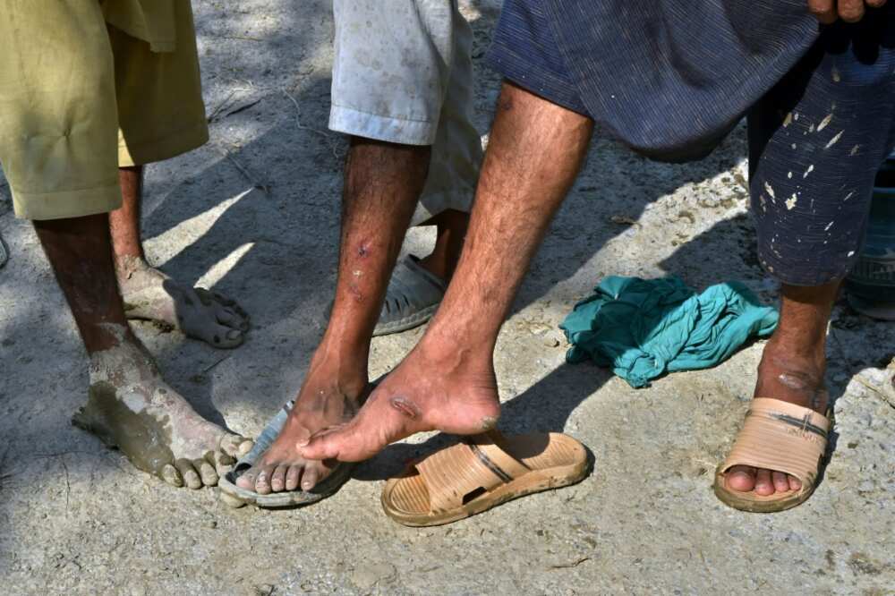 Many people have got cuts and sores from wading through flooded fields Many people have got cuts and sores from wading through flooded fields