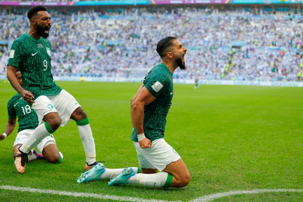 Saudi Arabia's Saleh al-Shehri celebrates after scoring his team's first goal, on the way to a 2-1 victory over Argentina that stunned the world
