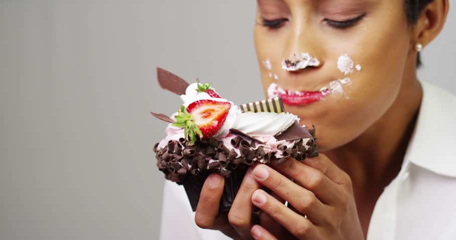 woman eats cupcake