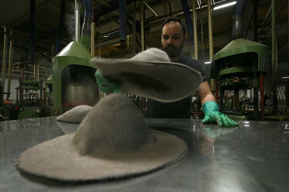Artisans mould and shape the Fedoras, using quick gestures with surgical precision Artisans mould and shape the Fedoras, using quick gestures with surgical precision