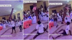 Na juju? Young man causes stir at event as he holds a bench with only his teeth while doing legwork in video