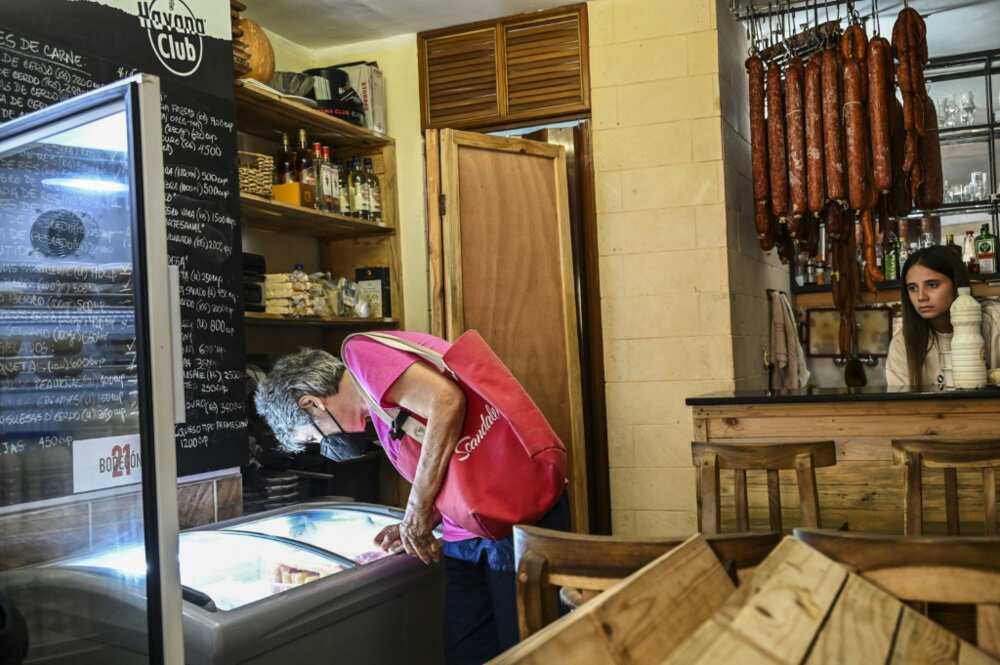In a private store, a kilogram of milk powder sells forabout 2,000 pesos (some $16) -- just less than half the average monthly salary In a private store, a kilogram of milk powder sells forabout 2,000 pesos (some $16) -- just less than half the average monthly salary