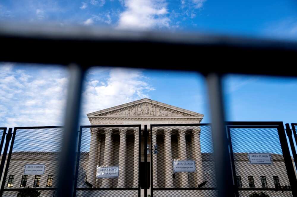 The US Supreme Court, protected from protesters by temporary fencing The US Supreme Court, protected from protesters by temporary fencing