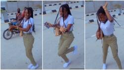 Cute lady in NYSC uniform jumps onto expressway, bursts into Buga dance challenge, stunning video goes viral