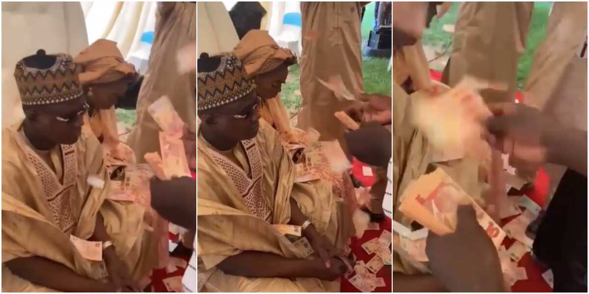 Hilarious video of couple looking unhappy as friends spray them with mint N10 notes on wedding day (video)