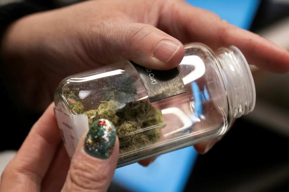 A customer looks at marijuana buds at the Proper Cannabis dispensary in Kansas City, Missouri A customer looks at marijuana buds at the Proper Cannabis dispensary in Kansas City, Missouri