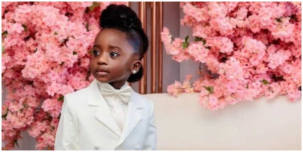 Photo of a little girl dressed as a ringbearer.