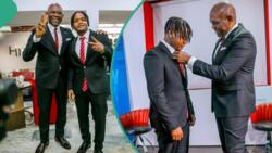 "E nearly reach him knee": Video of Tony Elumelu helping singer Crayon with his lengthy tie trends