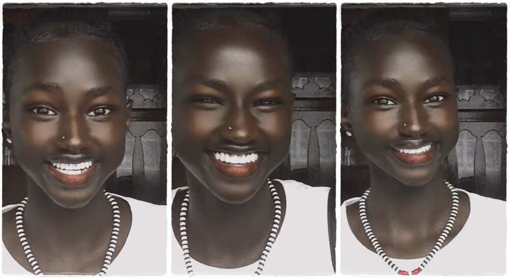 Photos of a beautiful black girl with sparkling white teeth.