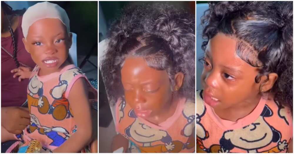 Little girl in tears as she fixes frontal wig.