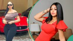 Regina Daniels shows off multi-billion-naira garage as she poses elegantly in front of exotic rides